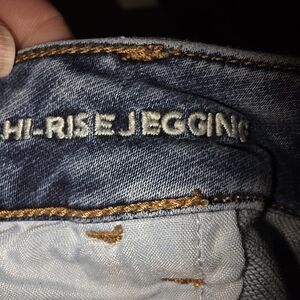 American Eagle Outfitters dark blue denim jeggings with brown topstitching